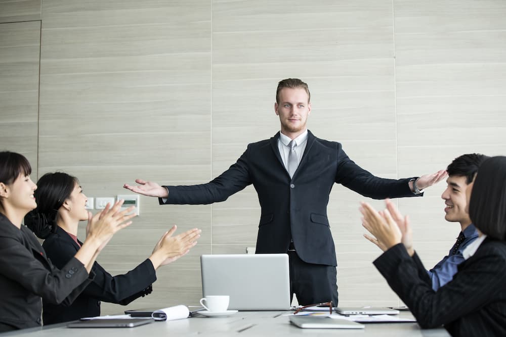 Team clapping to a sales representative because of promotion.